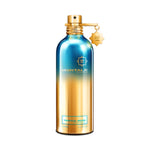Montale Tropical Wood Eau de Parfum – exotic fruity woody fragrance blending pineapple, bergamot, and oud notes in a vibrant 100ml metallic blue and gold gradient bottle with luxurious gold detailing.