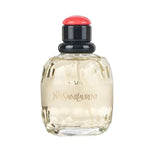 Yves Saint Laurent Paris Eau de Parfum in a faceted clear bottle with light golden liquid and a black cap topped with a red button-like detail.
